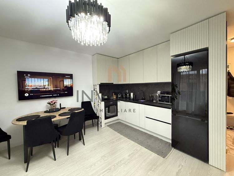 Locuință elegantă cu terasă generoasă și parcare subterană - 1