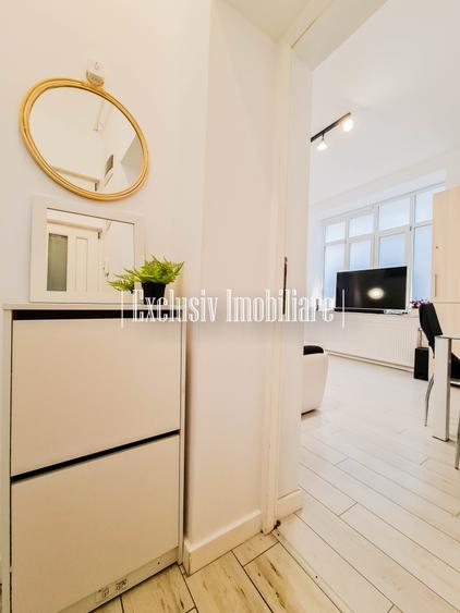 Apartament cu 3 camere semidecomandat, mobilat în Central