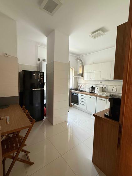 Apartament de inchiriat cu 2 camere si loc de parcare subteran, modern, spatios si luminos, situat intr-un bloc nou pe str. Caracal. - 1