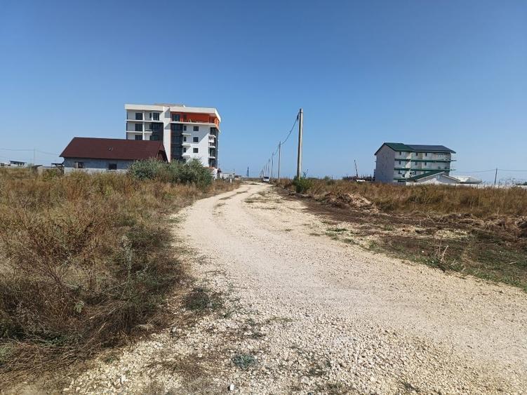 Vând teren intravilan 1050mq,pe colț, al treilea rand la mare, zona Epava - 2