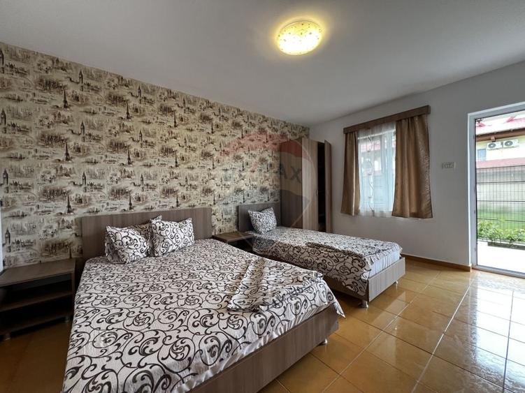 Casă individuală cu 9 camere cu Teren 480 Mp în Sud