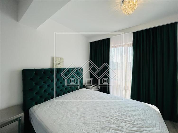 Ap pe 2 niveluri, 75 mp utili + 2 balcoane, mobilat modern - 17
