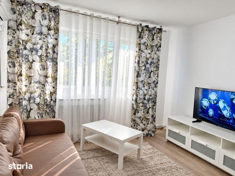 Apartament cu 2 camere semidecomandat, mobilat în Podu Roș