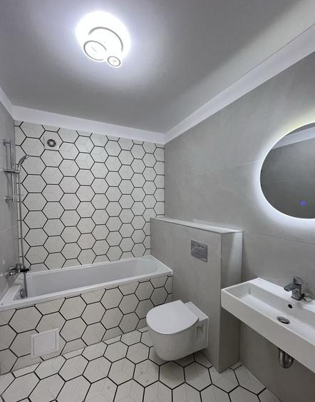 Apartament cu 3 camere decomandat în Tractorul