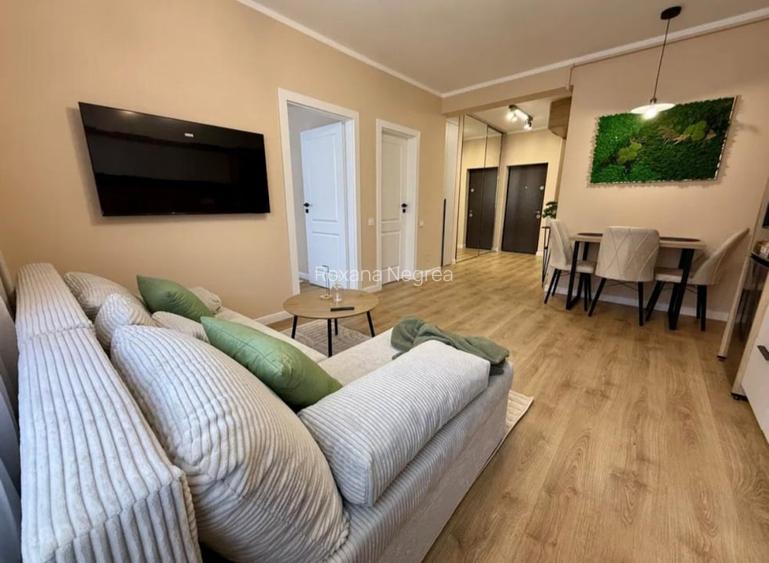 Apartament ultrafinisat,cu 2 camere si parcareetaj intermediar,zona Parc Poligon