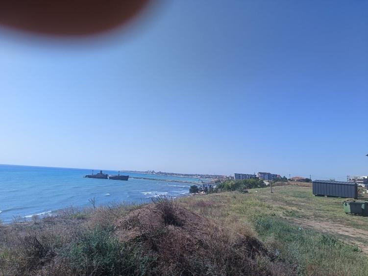 Vând teren intravilan 1050mq,pe colț, al treilea rand la mare, zona Epava - 7