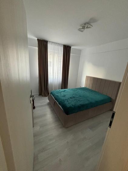 Apartament cu 3 camere decomandat în Cățelu