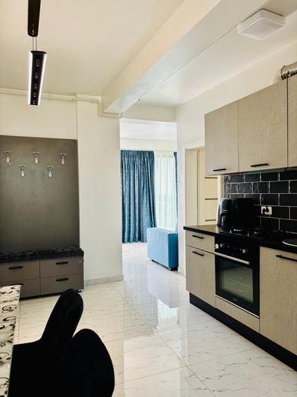 Apartament cu 2 camere semidecomandat, mobilat în Central