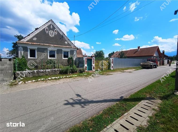 Casă cu 4 camere decomandat cu Teren 1650 Mp în Porumbacu de Jos