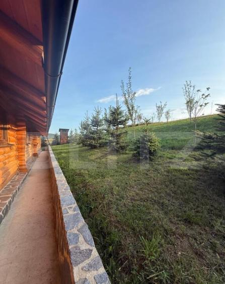 Cabana din lemn rotund, 2 camere, 140 mp, teren 2800 mp, Pal - 16