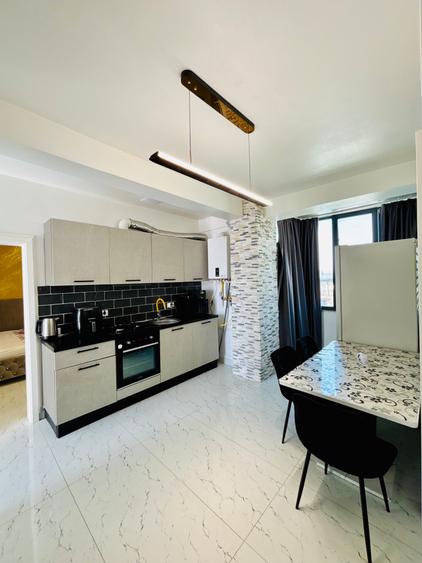 Apartament cu 2 camere semidecomandat, mobilat în Central