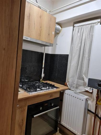 Garsoniera cu centrala la parter zona Buziasului - 8