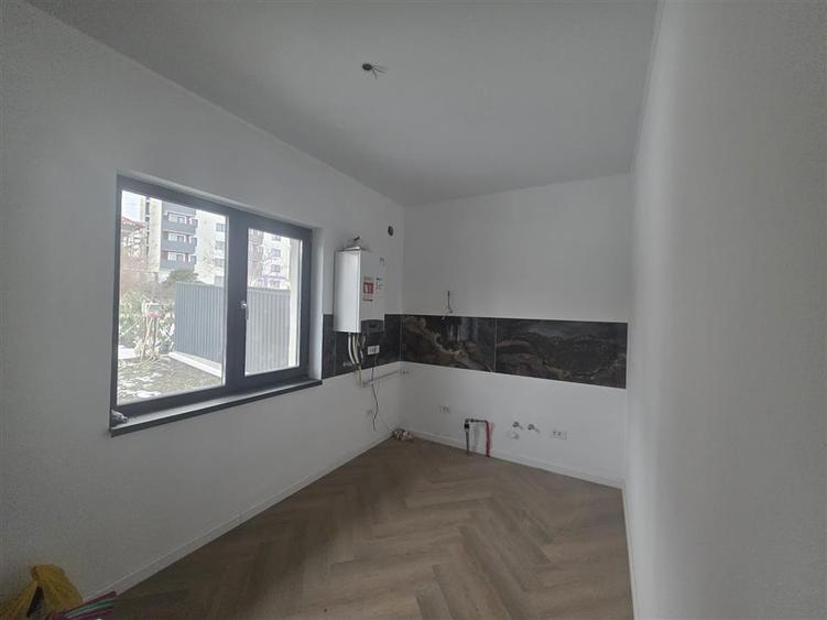 Apartament cu 4 camere decomandat în Bucium