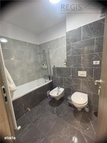 Apartament cu 2 camere semidecomandat, mobilat în Tractorul