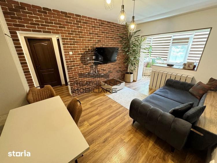 Apartament cu 3 camere semidecomandat în Podu Roș