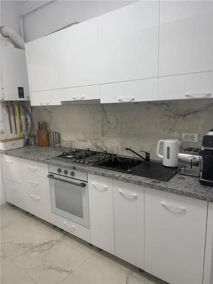 GIROC - 2 CAMERE - ETAJUL 1 - DECOMANDAT - MOBILAT SI UTILAT - PARCARE INCLUSA - 6