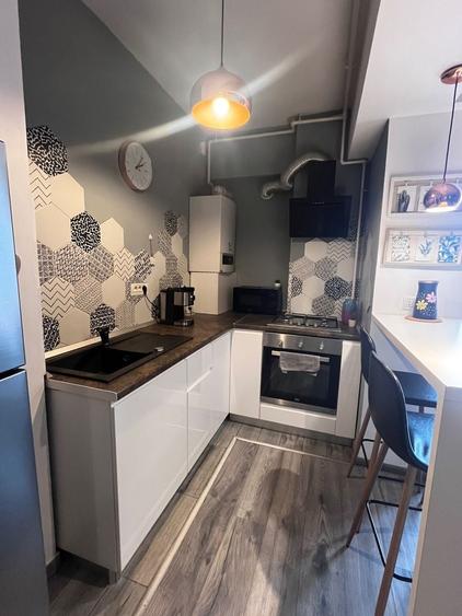 Oază de liniște la Unirii: Apartament modern în bloc nou, costuri minime - 3