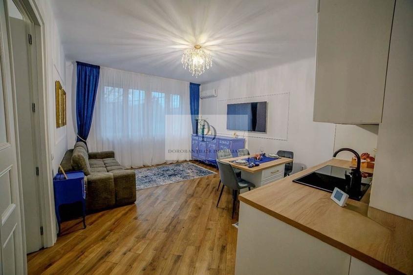 Apartament cu 3 camere semidecomandat, mobilat în Central