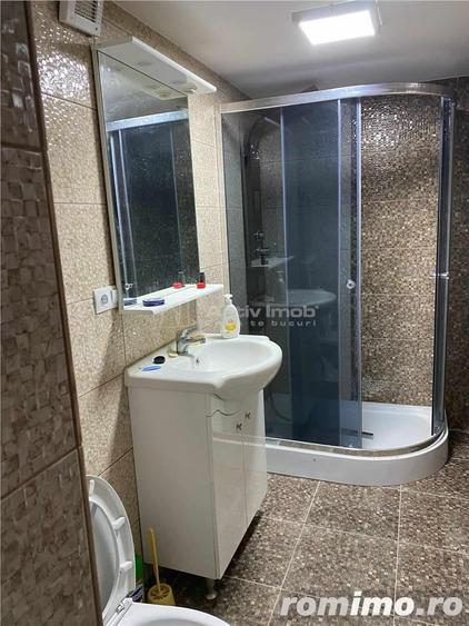 Casă cu 12 camere cu Teren 1000 Mp în Români