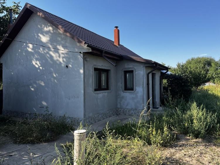 Casă cu 4 camere în Unirea