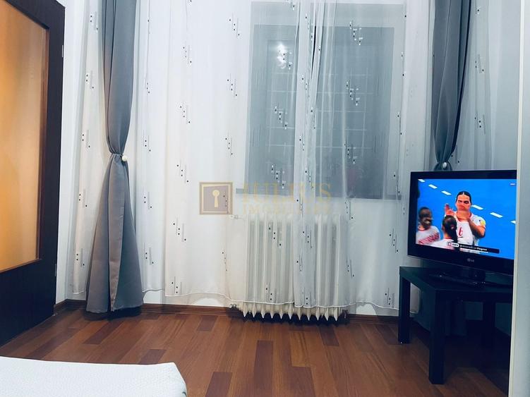 Apartament cu 2 camere semidecomandat, mobilat în Take Ionescu