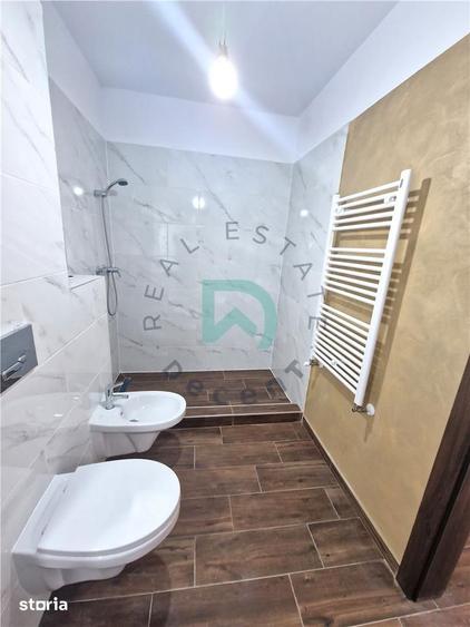 Apartament cu 3 camere decomandat în Tractorul
