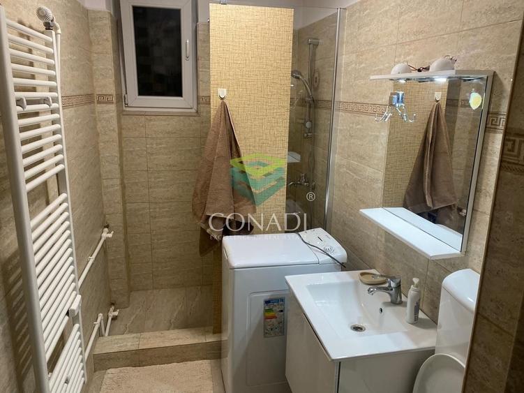 Apartament cu 3 camere semidecomandat, mobilat în Calea București