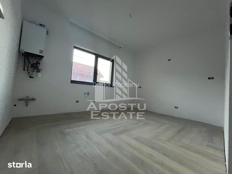 Duplex cu 4 camere, 3 bai,teren 250 mp in zona Dambovita