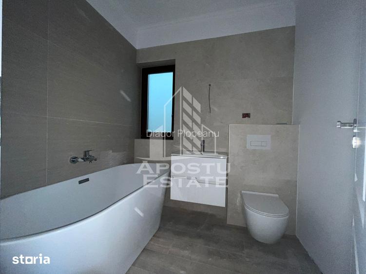 Duplex cu 4 camere, 3 bai,teren 250 mp in zona Dambovita