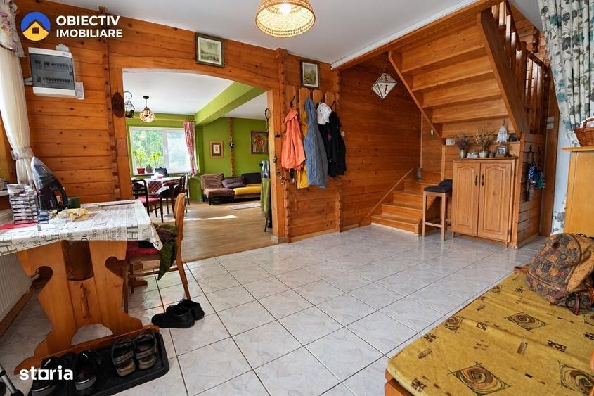Casa din lemn P+M 191 mp, teren 2.199 mp, Almas - Garcina, zona retras - 1