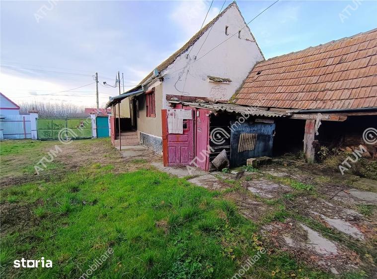 Casă cu 4 camere decomandat cu Teren 1650 Mp în Porumbacu de Jos