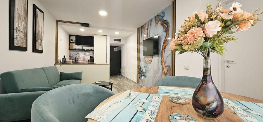 Apartament cu 3 camere semidecomandat, mobilat în Central