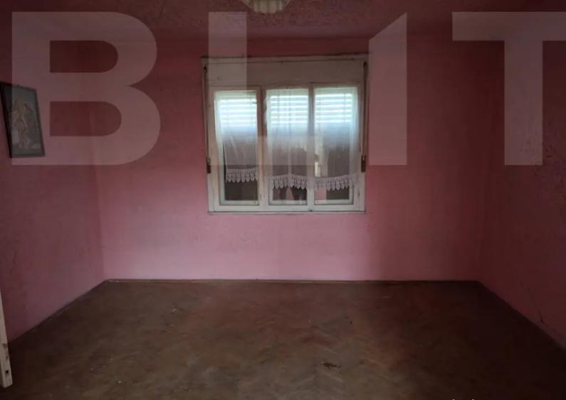 Casă cu 4 camere cu Teren 1000 Mp în Central