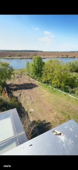 Teren intravilan 2.300 mp cu deschidere la lac, Ciofliceni - 1