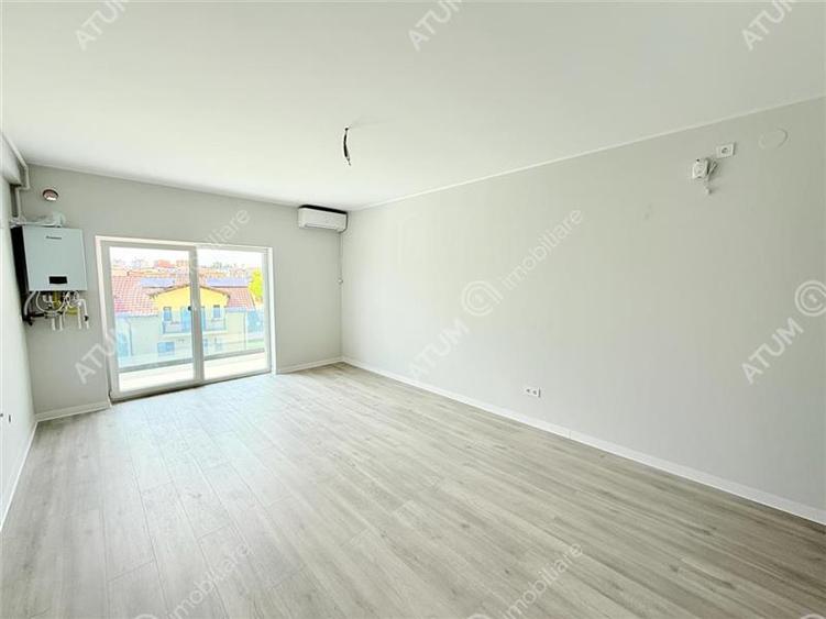Apartament cu 3 camere decomandat în Șelimbăr — fotografia 2