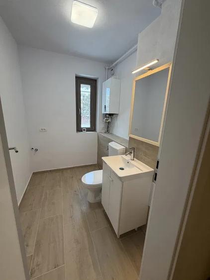 Apartament cu 3 camere semidecomandat, mobilat în Borhanci