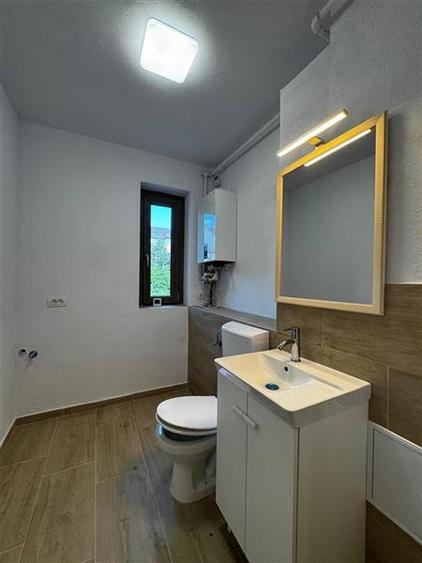 Apartament cu 3 camere semidecomandat, mobilat în Borhanci