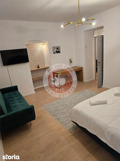 Apartament cu 4 camere decomandat în Romană