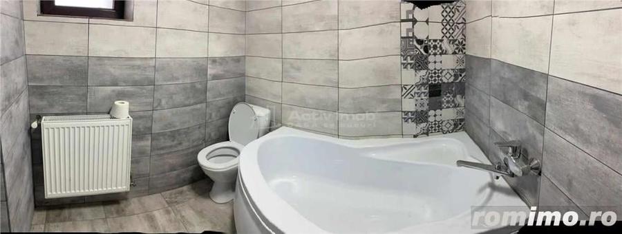 Casă cu 12 camere cu Teren 1000 Mp în Români