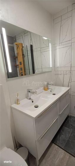 Apartament cu 3 camere semidecomandat, mobilat în 1 Mai