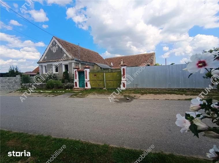 Casă cu 4 camere decomandat cu Teren 1650 Mp în Porumbacu de Jos