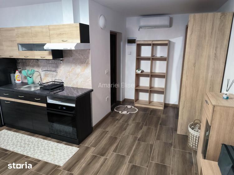 Garsoniera de inchiriat, cu gradina, parcare ?i terasa
