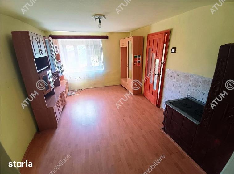 Casă cu 4 camere decomandat cu Teren 1650 Mp în Porumbacu de Jos