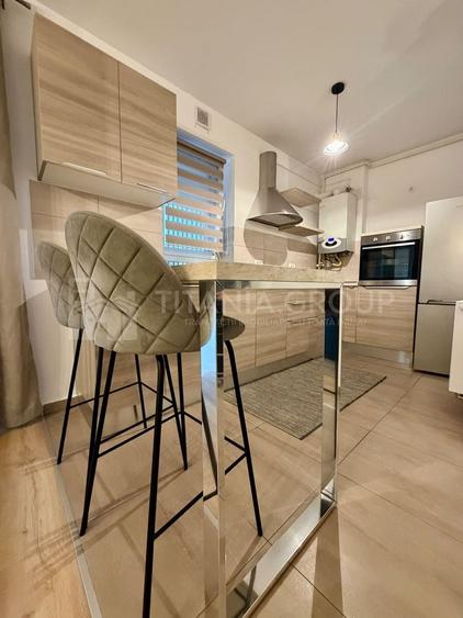 Apartament cu 2 camere semidecomandat, mobilat în Tractorul