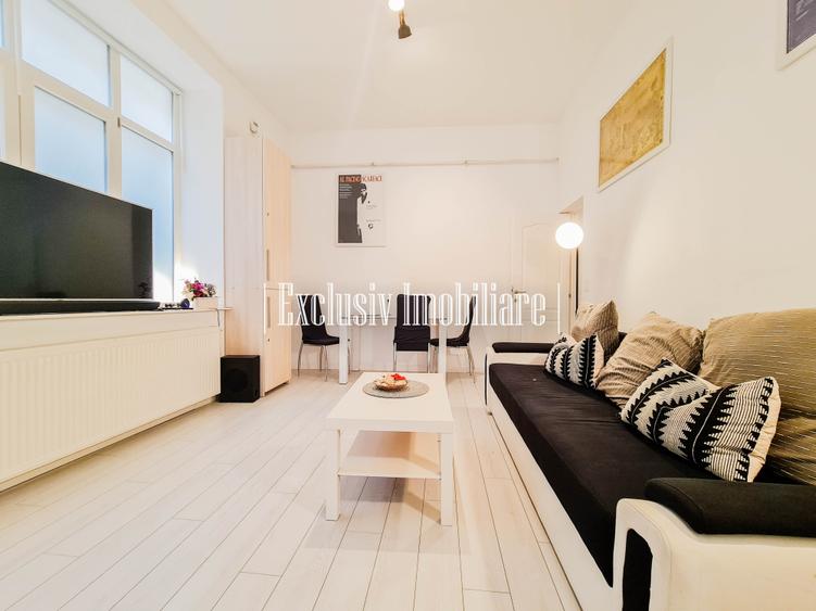 Apartament cu 3 camere semidecomandat, mobilat în Central