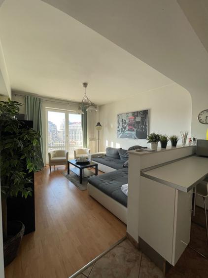 Apartament cu 3 camere decomandat, mobilat în P-ța Romană — fotografia 1