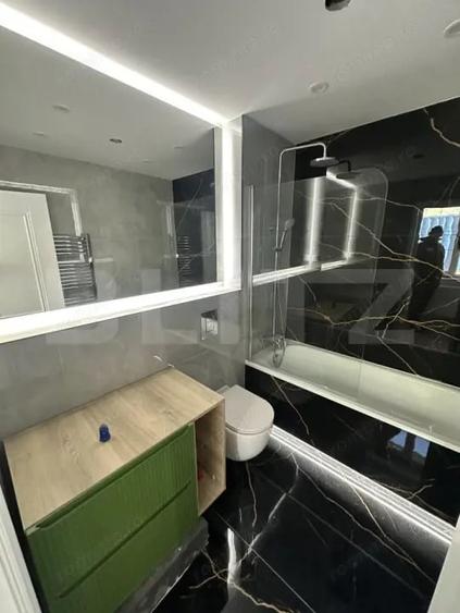 Apartament cu 2 camere semidecomandat, mobilat în Central