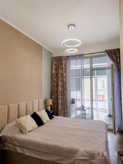 Apartament cu 2 camere semidecomandat, mobilat în Central
