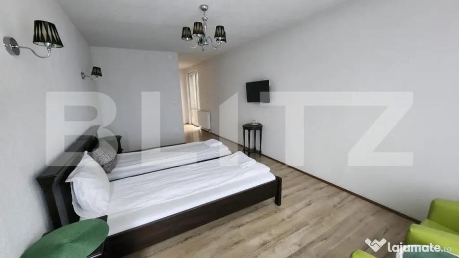 Casă cu 10 camere cu Teren 1100 Mp în Corunca