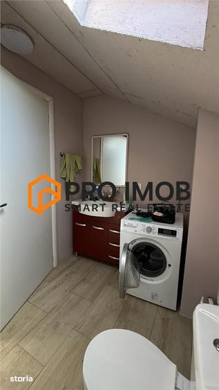 Casa tip P+M si garaj zona Spataru - Costesti - 11